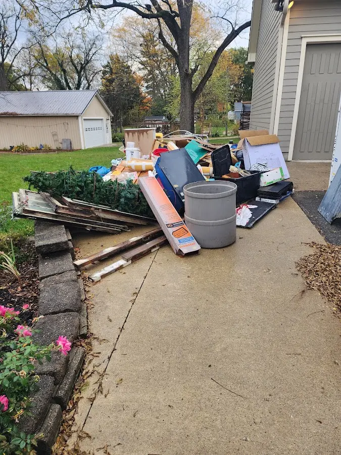 Dumpster being loaded with debris for 12 Yard Dumpster Rental in El Granada
